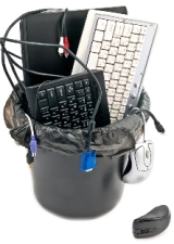 Recycle Waste Basket With Keyboards, Cords, and a Laptop Inside